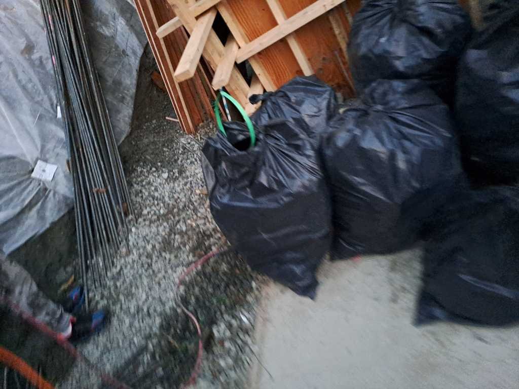 site-cleanup Construction site cleanup with garbage bags